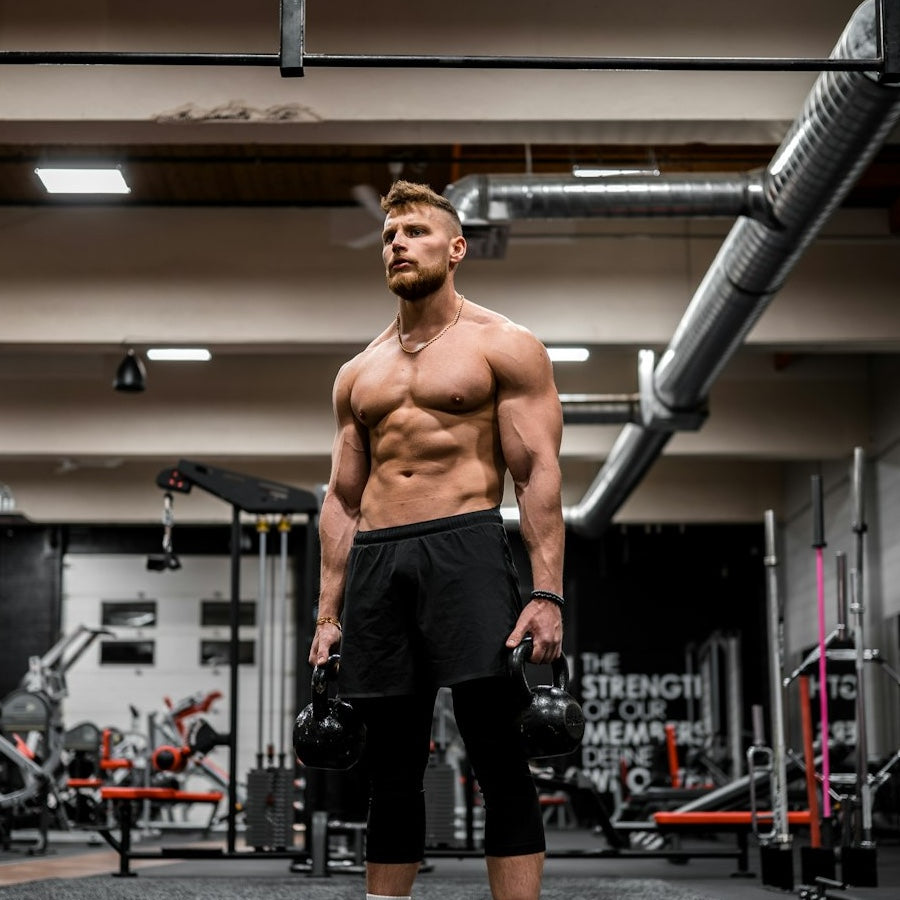 athlete stretching before morning workout with greens smoothie