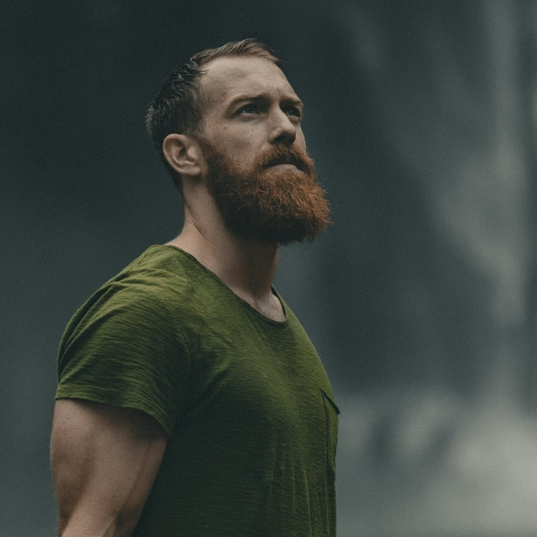 runner doing strength training with supplement bottle nearby