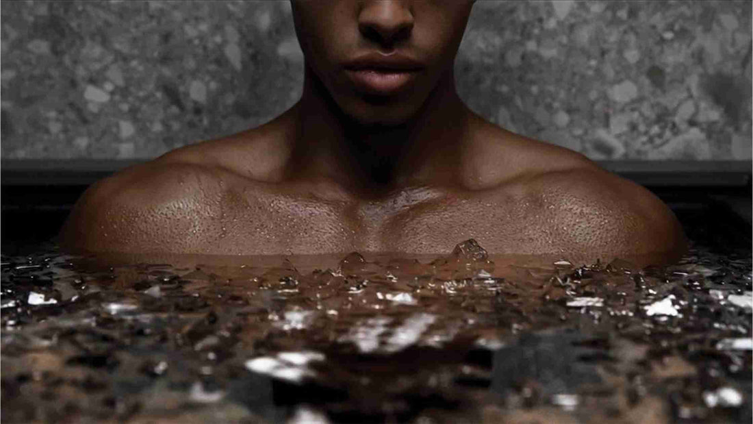 hero image: athlete immersed in ice bath outdoors with calm focus