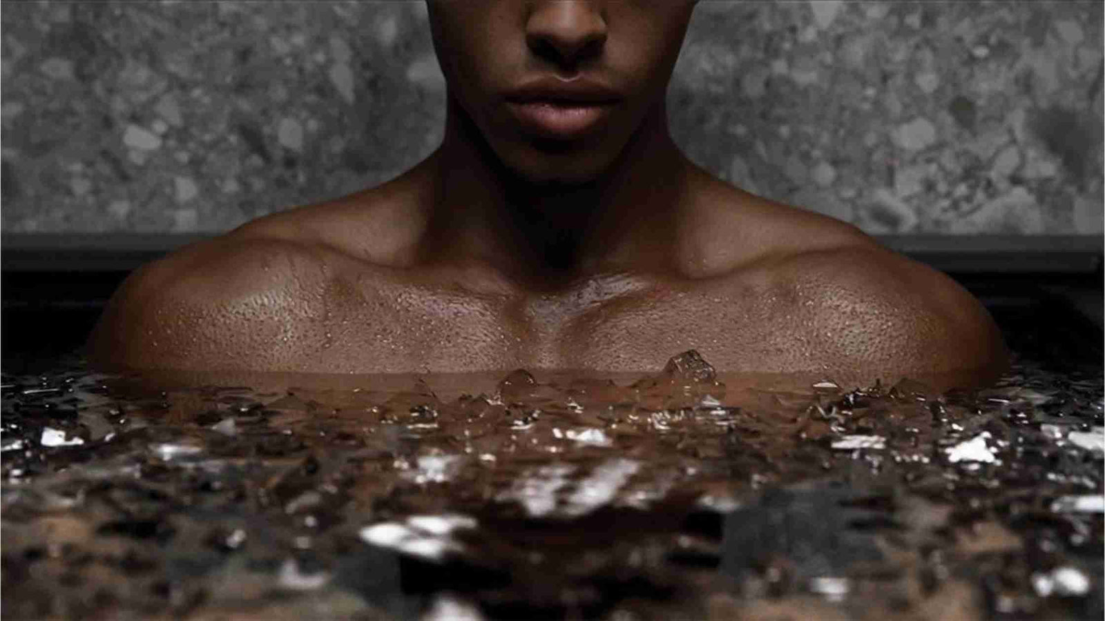 hero image: athlete immersed in ice bath outdoors with calm focus
