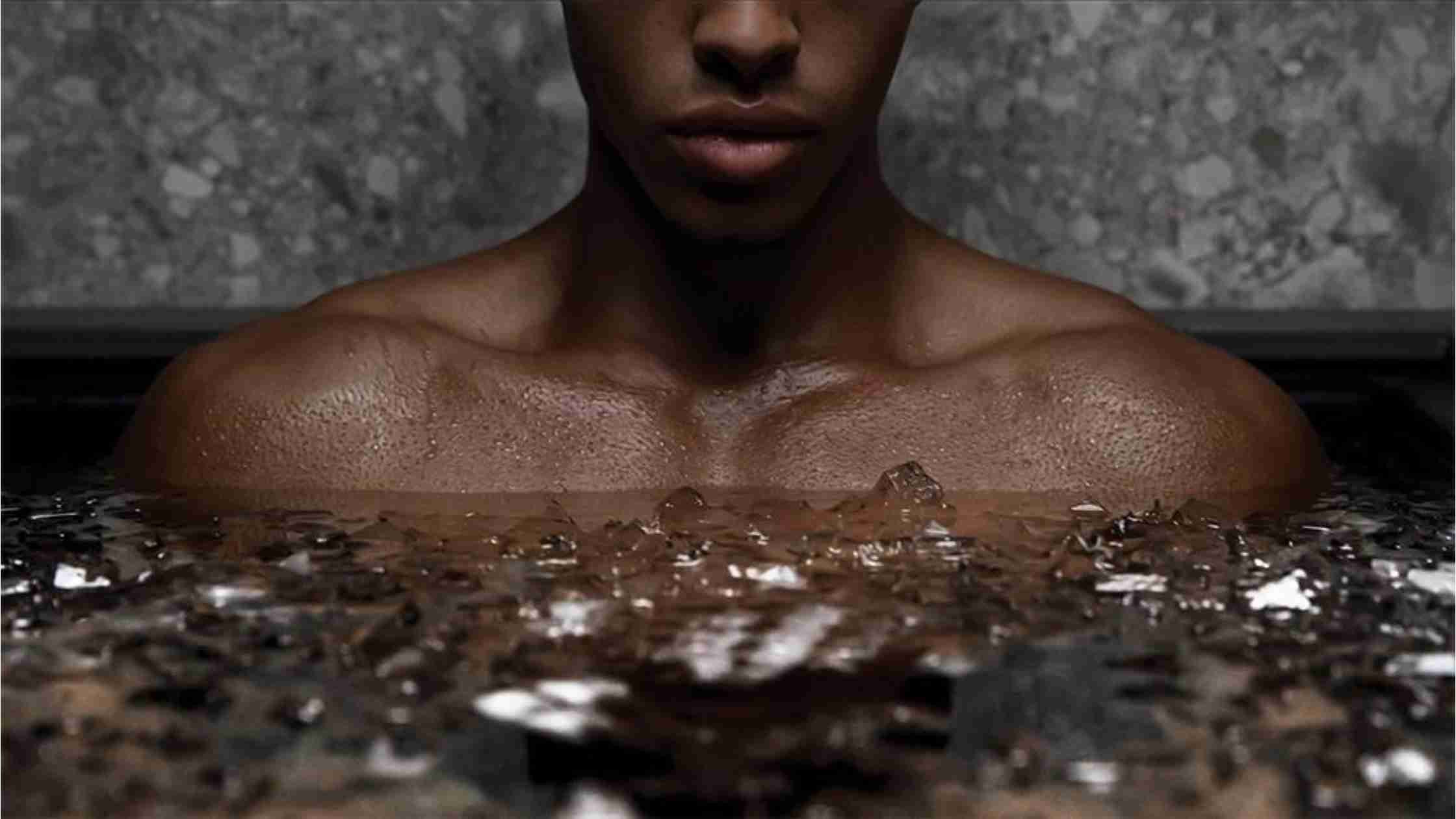 hero image: athlete immersed in ice bath outdoors with calm focus