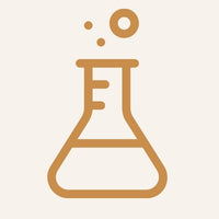 Gold beaker icon on a beige background