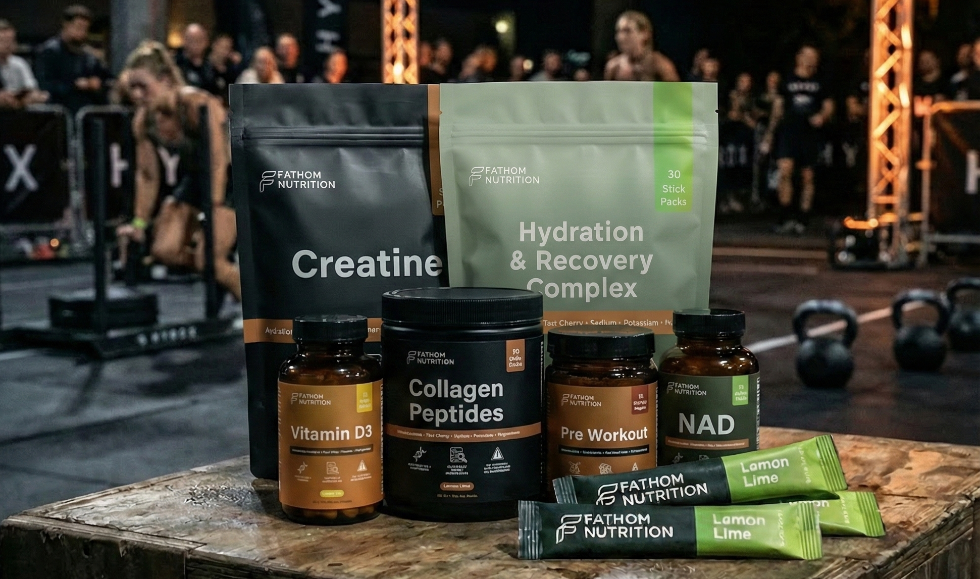 Supplement products including creatine, hydration and recovery complex, and vitamins on a table with a gym background.
