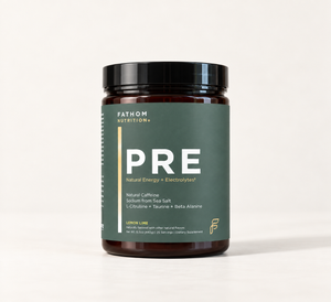 A dark amber supplement bottle with a black lid and a dark green label reading FATHOM NUTRITION PRE, photographed on a clean white studio background.