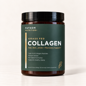 A jar of Fathom Nutrition Grass Fed Collagen powder, featuring a dark green label and black lid, set against a clean white background.