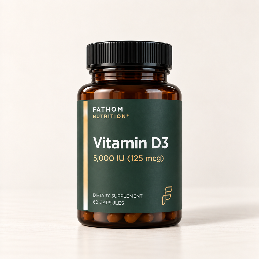 A bottle of Fathom Nutrition Vitamin D3 dietary supplement, 5,000 IU (125 mcg), 60 capsules. The product is in an amber glass bottle with a black ribbed cap and a dark green label featuring gold and white text.