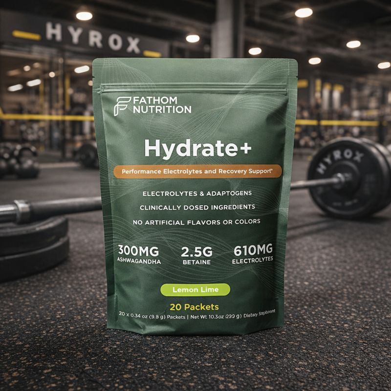 Fathom Nutrition Hydrate+ supplement package in a gym setting